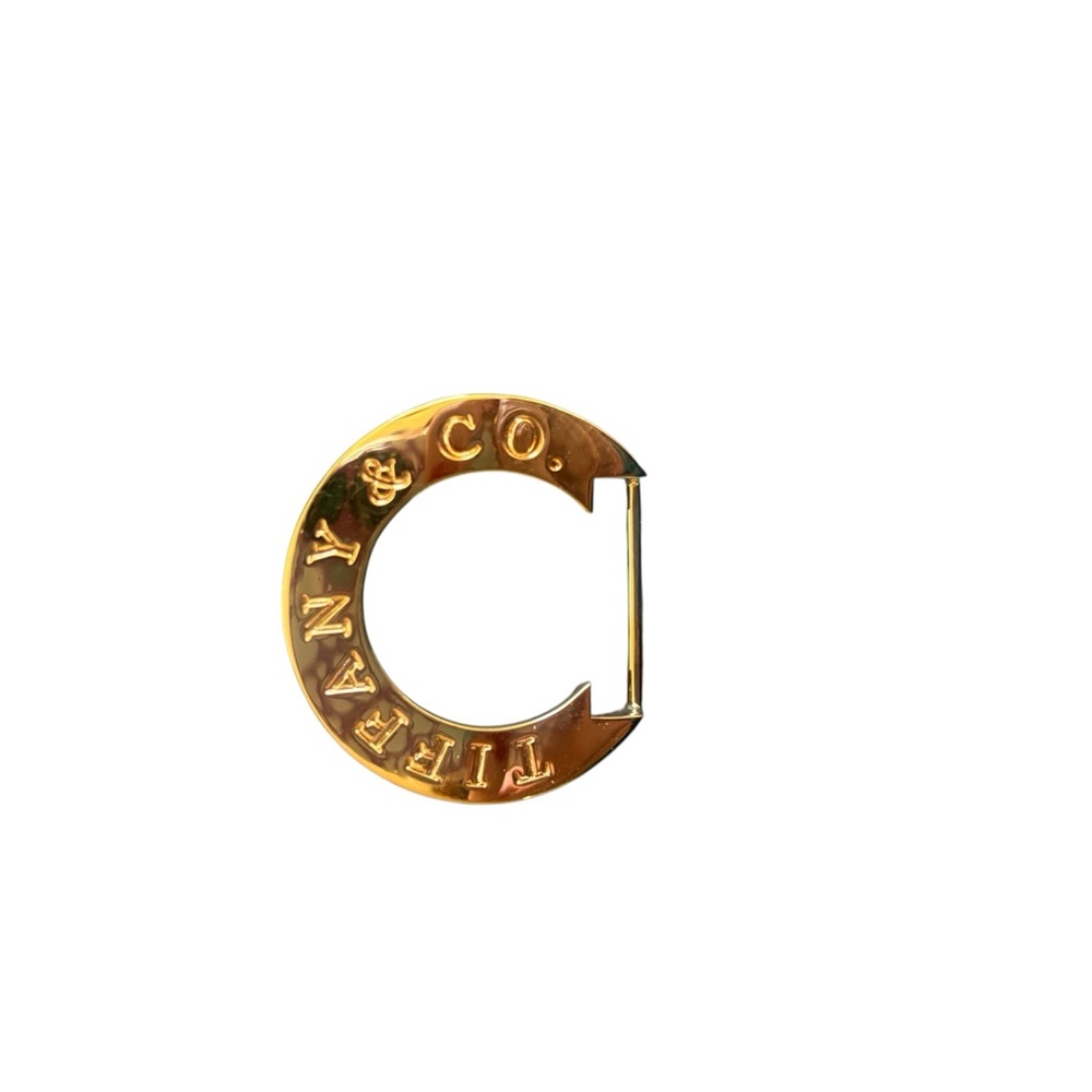 Tiffany & Co. Gold metal belt buckle . NEW